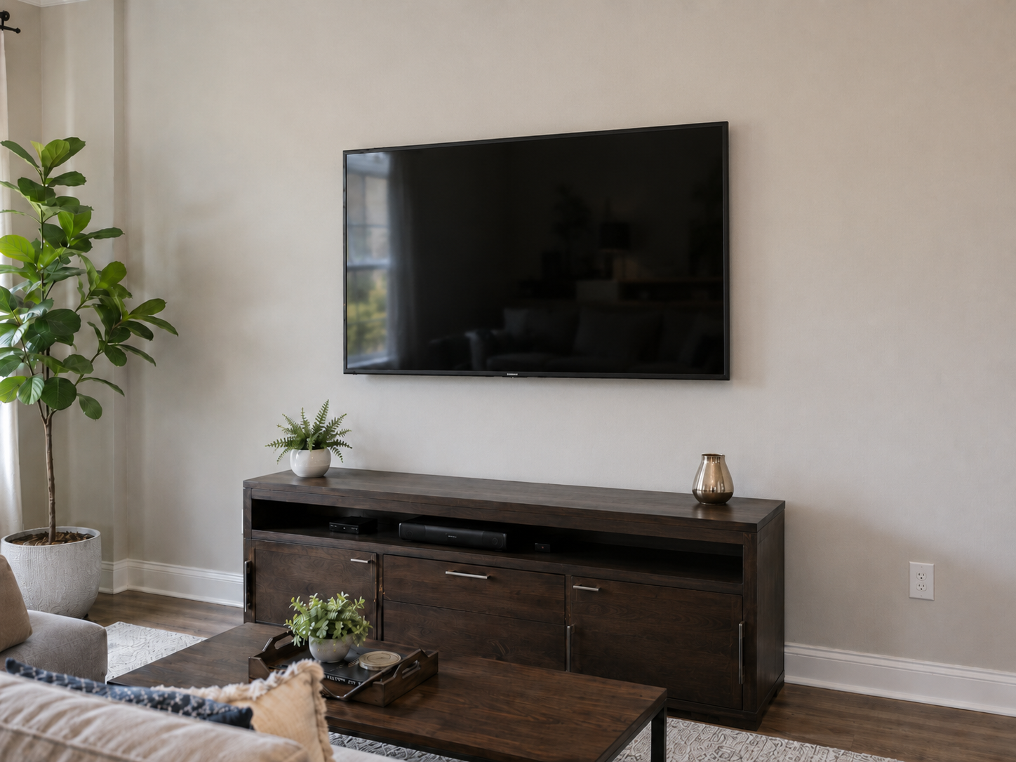 Finished living room with wall-mounted television